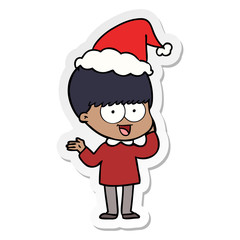 happy sticker cartoon of a boy wearing santa hat