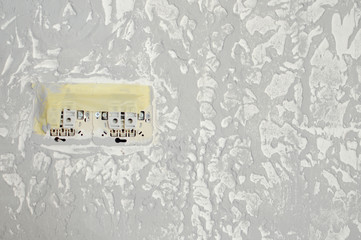 Electric sockets light works mounting and installation on plaster wall background. Professional installation of electrical outlets, wires and switches. Close up side view.