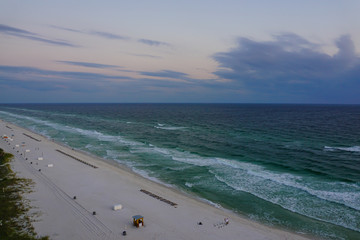 Aerial view of a beautiful sunset on Panama City Beach in Florida on a cloudy night.