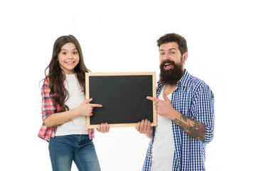 Father and daughter pointing at blank chalkboard. List things to do together. Child and father best friends. Parenthood and childhood. Fathers day concept. Lovely father and cute kid. Check this out