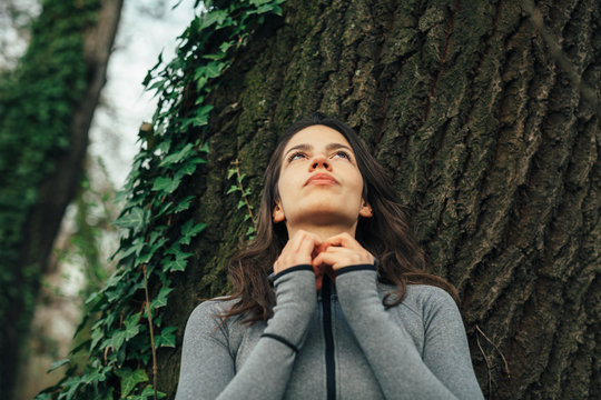 Young beautiful woman exercise in the forest
