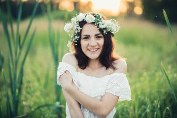 Fototapeta na wymiar happy attractive girl in white dress smiling happily
