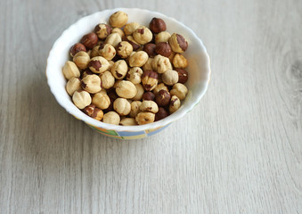 Healthy food  for background image close up hazelnuts.  Nuts texture on white grey table top view