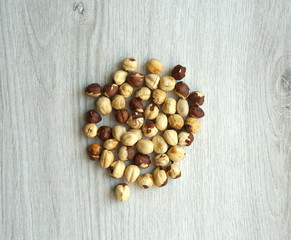 Healthy food  for background image close up hazelnuts.  Nuts texture on white grey table top view