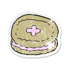 retro distressed sticker of a cartoon biscuit