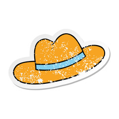distressed sticker cartoon doodle of a hat