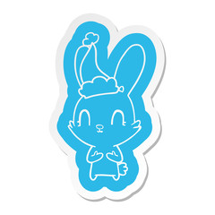 cute cartoon  sticker of a rabbit wearing santa hat