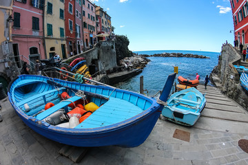 Fototapeta na wymiar Nautical vessel in front of the harbor of Riomaggiore, Cinque Terre, Italy