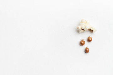 Concept with popcorn and corn - popcorn corn rains from a poped corn