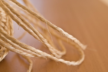 Tangled string on wooden table.