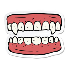sticker of a cartoon vampire teeth