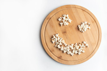 Fototapeta na wymiar Popcorn in bowl on white background