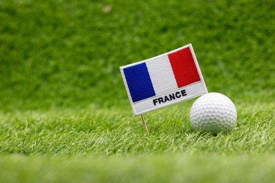 golf ball with France Flag are on green grass
