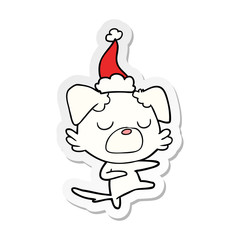 sticker cartoon of a dog wearing santa hat