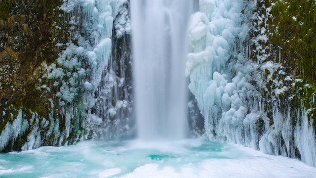 Icy Blue Frozen Waterfall In Oregon USA