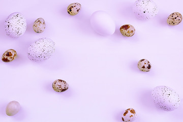 Easter. Easter eggs on a purple neon background. Selective focus, toning, blur.