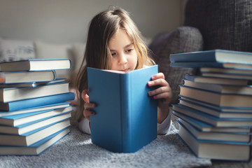 Cute Little girl reading book