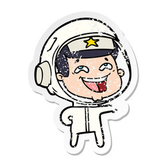 distressed sticker of a cartoon laughing astronaut
