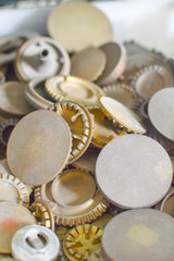 Gas plates spare parts for cooker, product shopping display background. Closeup on golden and gray shiny round shape elements of household appliance.