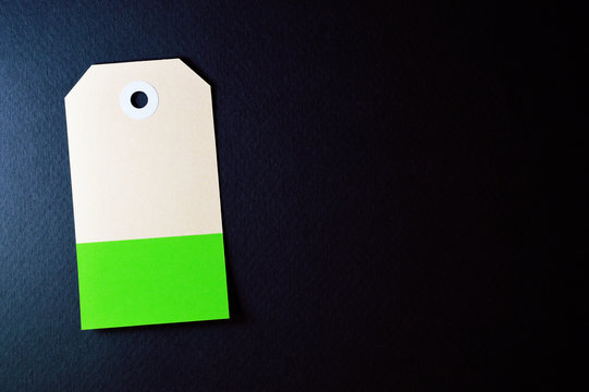 vectical clipped rectangle paper tag on dark background