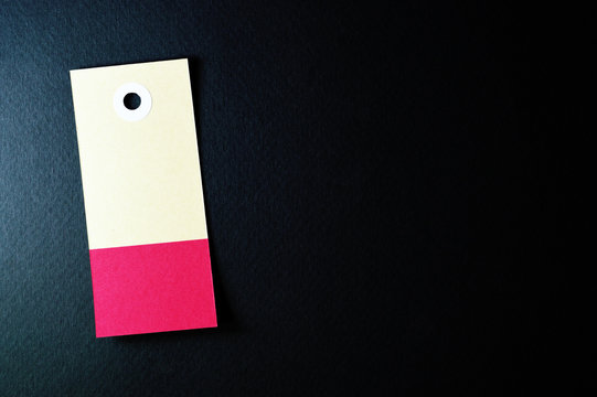 vectical rectangle paper tag on dark background