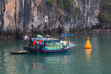 Fototapeta na wymiar Fisherman in Halong Bay