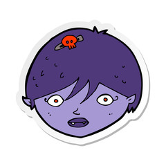 sticker of a cartoon vampire face