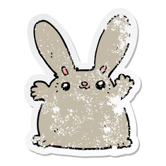 distressed sticker of a cartoon rabbit