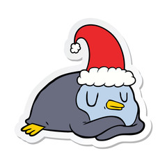 sticker of a cartoon penguin wearing christmas hat
