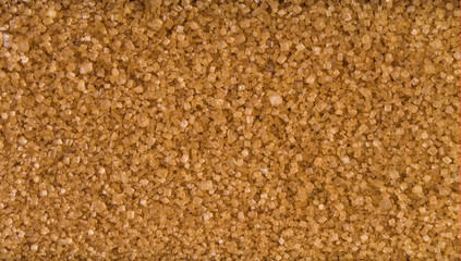 Brown or cane sugar background. Natural seasoning texture. Natural spices and food ingredients.
