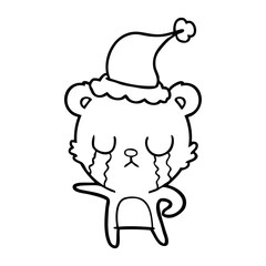 crying line drawing of a bear wearing santa hat