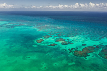 Turquoise water with reef aerial drone