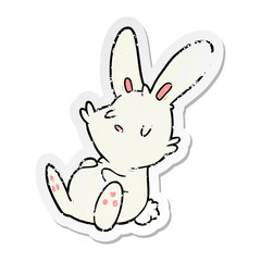 distressed sticker of a cartoon rabbit sleeping