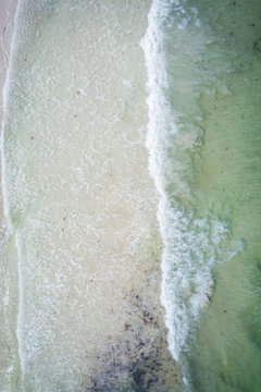 Drone waves crashing on beach