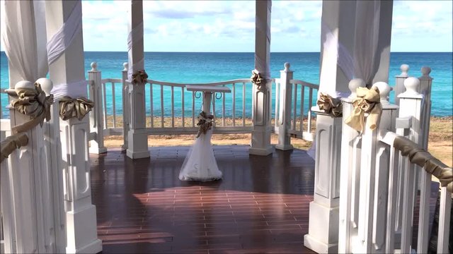 Wedding gazebo set up for a civil ceremony in a tropical seaside garden on a Caribbean island