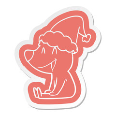 sitting bear cartoon  sticker of a wearing santa hat