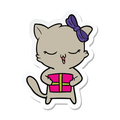 sticker of a cartoon girl cat with christmas present