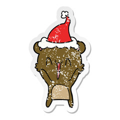 happy bear distressed sticker cartoon of a wearing santa hat