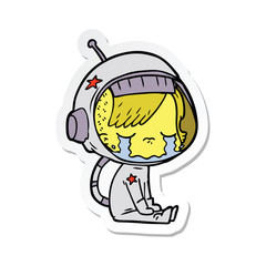 sticker of a cartoon crying astronaut girl sitting