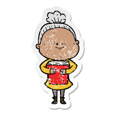 distressed sticker of a cartoon happy old woman