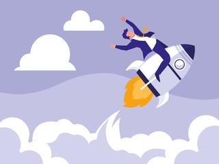 successful businessman celebrating in rocket