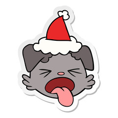 sticker cartoon of a dog face wearing santa hat