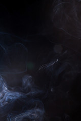 White smoke on black background.