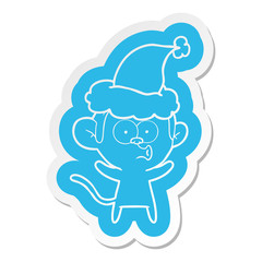 cartoon  sticker of a surprised monkey wearing santa hat