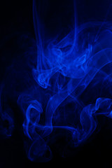 Blue smoke on black background.