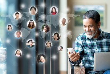 Social media network,  Global network connection and people connecting all over the world map. Smiling happy mature man using smartphone serving internet connect other person and play social media app