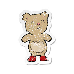 retro distressed sticker of a cartoon teddy bear