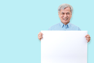 Happy grandpa smiling with white teeth, enjoy moment and holding a blank board. Asian older man...