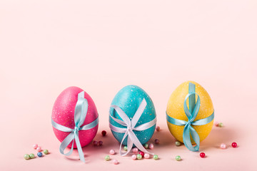 Three decorated eggs are in a row. Easter concept