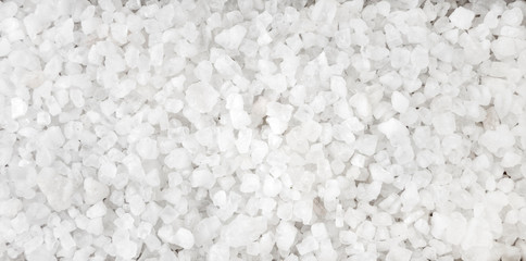 Fototapeta na wymiar white salt crystals background. Natural seasoning texture. Natural spices and food ingredients.